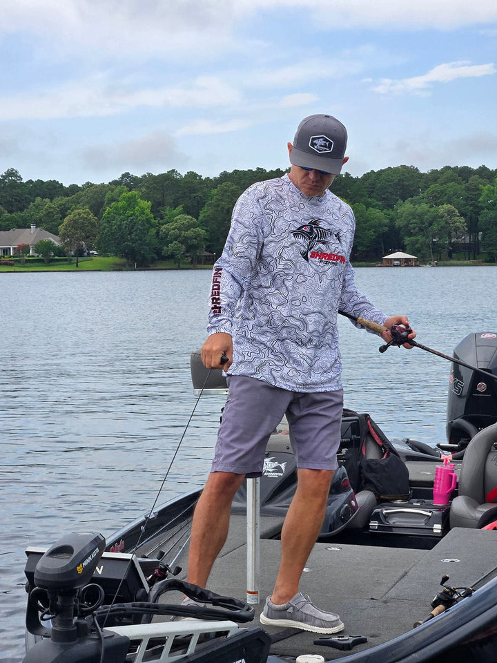 ShredFin Contourz Performance Shirt in white and black, lightweight athletic shirt with a fitted design and moisture-wicking fabric.
