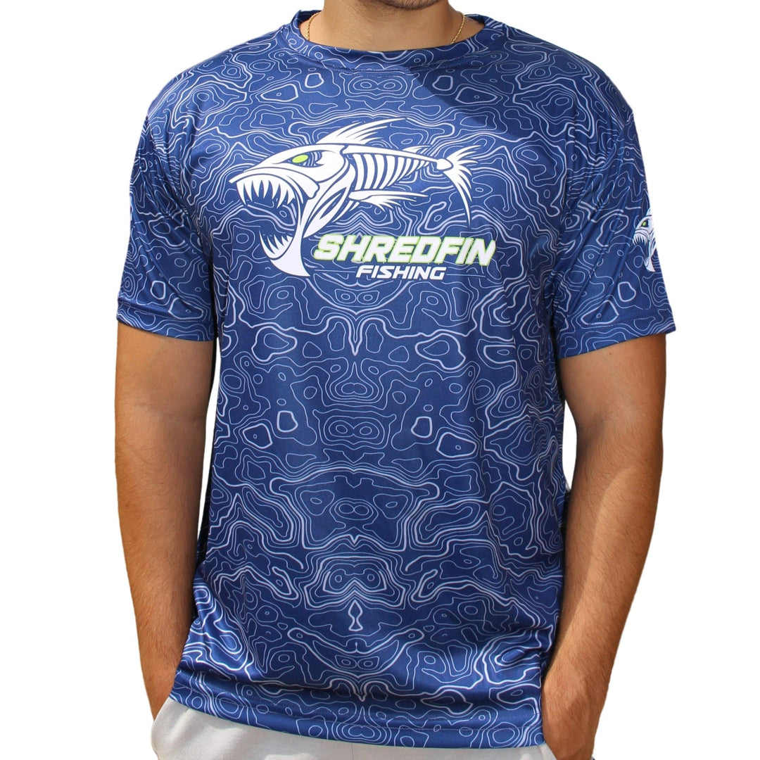 ShredFin Contourz short sleeve performance shirt in deep sea blue with a fitted design and moisture-wicking fabric.
