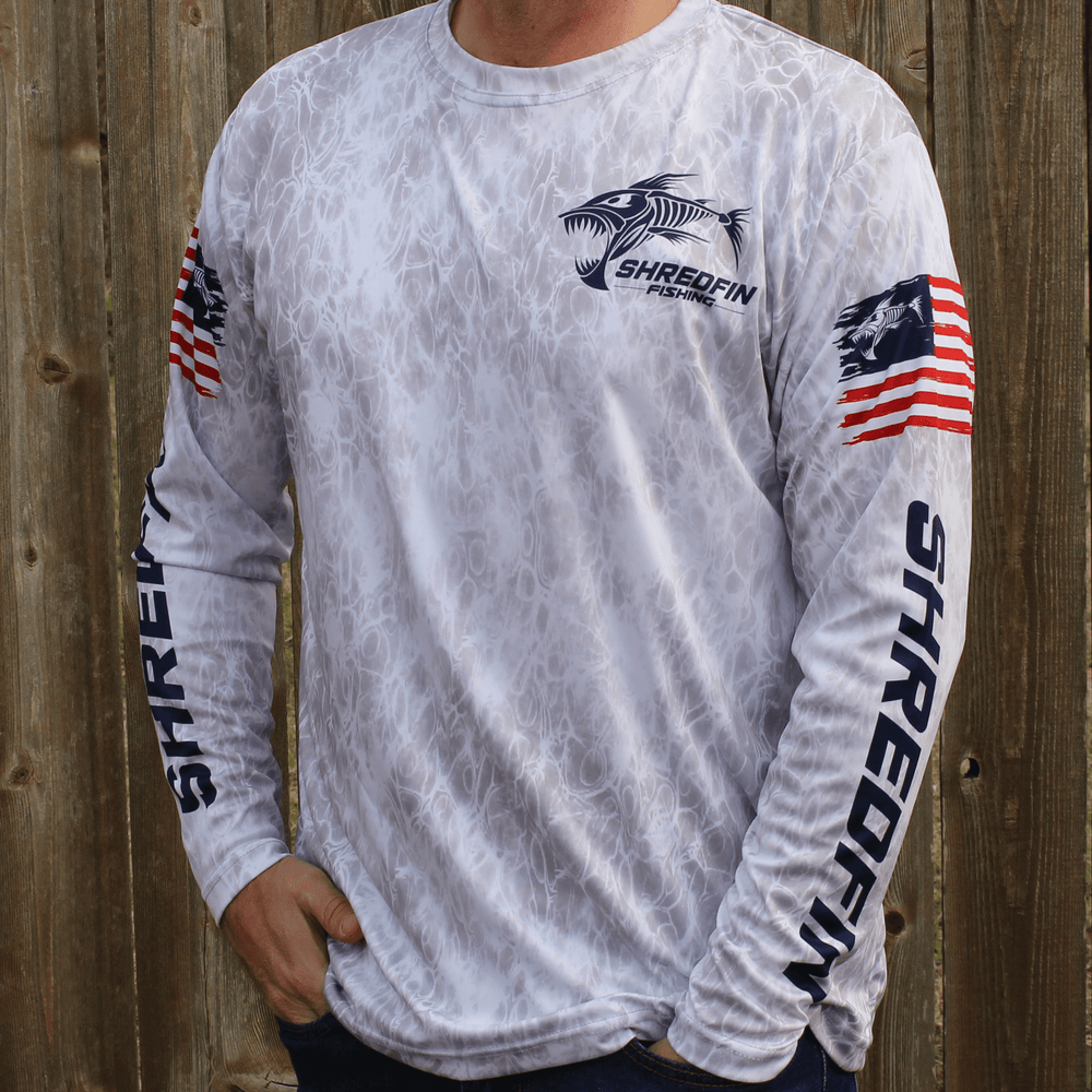 ShredFin Freedom Performance Shirt, lightweight athletic shirt with logo detail, designed for active wear and outdoor activities.