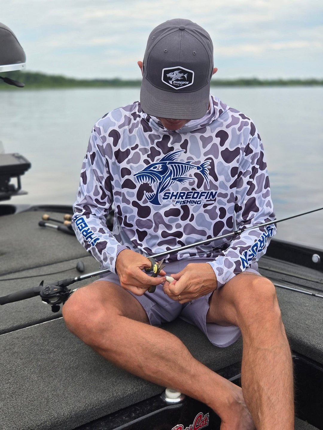 ShredFin Retro Camo Hooded Performance Shirt in overcast color, featuring a camouflage pattern and comfortable hooded design.