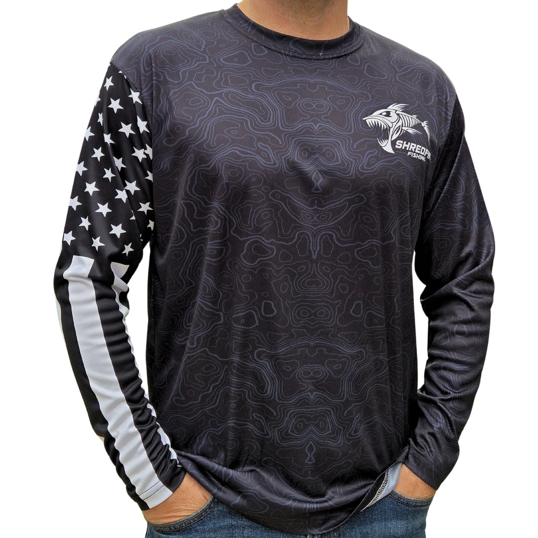 ShredFin Tactical Freedom Performance Shirt in black, close-up of lightweight, breathable fabric with tactical design details.