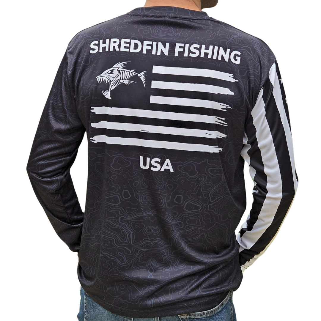 ShredFin Tactical Freedom Performance Shirt in black, close-up of lightweight, moisture-wicking fabric and tactical fit.