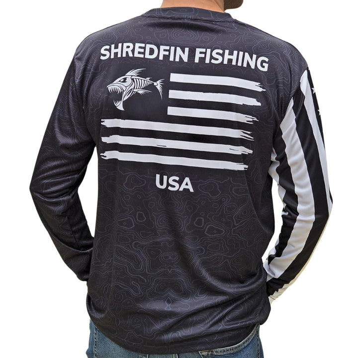 ShredFin Tactical Freedom Performance Shirt in black, close-up of lightweight, moisture-wicking fabric and tactical fit.