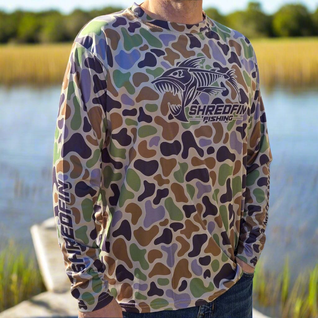 ShredFin Retro Camo Performance Shirt in camouflage design, featuring a comfortable fit and lightweight fabric for active wear.