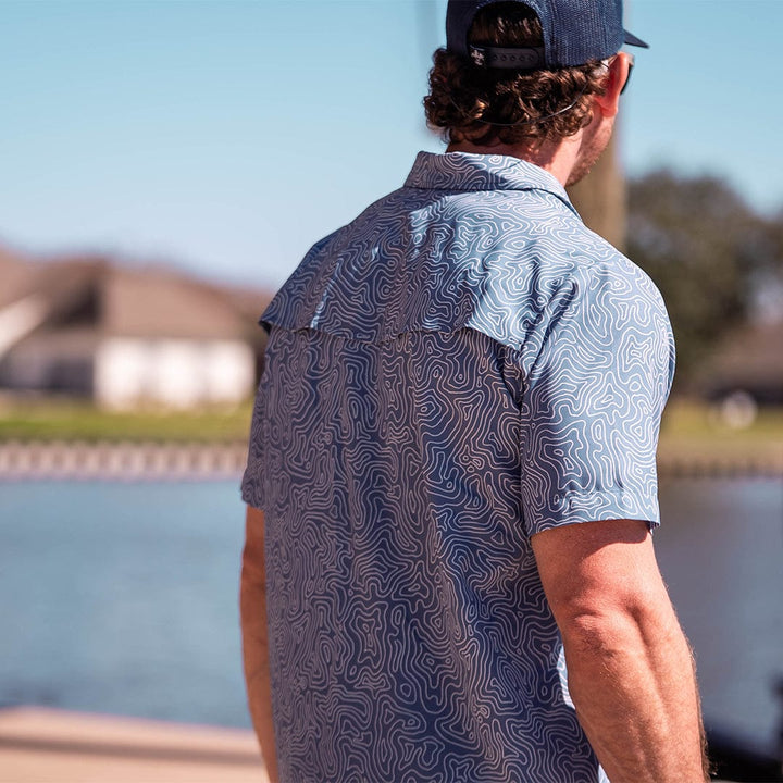 Old-school Fly Shirt by Sportsman Gear, featuring classic design and lightweight fabric, perfect for outdoor adventures.