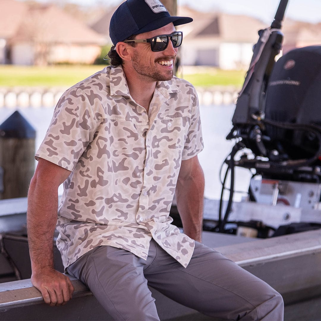 Old-school Fly Shirt by Sportsman Gear featuring a classic design and casual fit, displayed on a hanger.