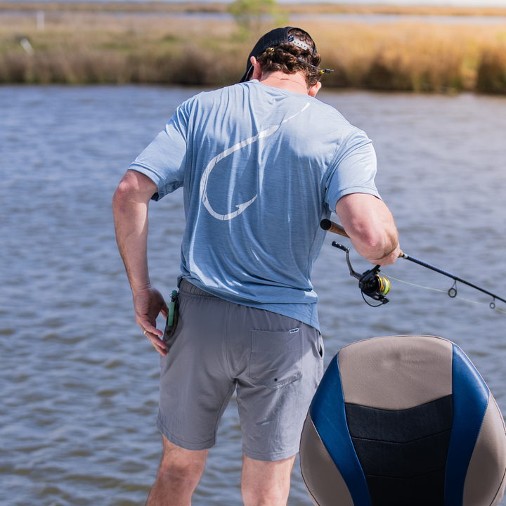 Steel Hook Cool T short sleeve performance fishing shirt by Sportsman Gear, lightweight with moisture-wicking fabric and sun protection.
