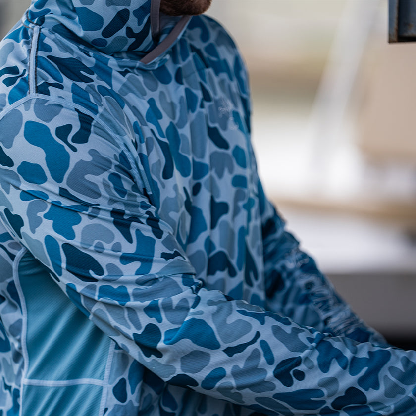 Small wave blue camo fishing hoodie from Sportsman Gear, Cool Breeze 2.0 Performance shirt designed for outdoor fishing.