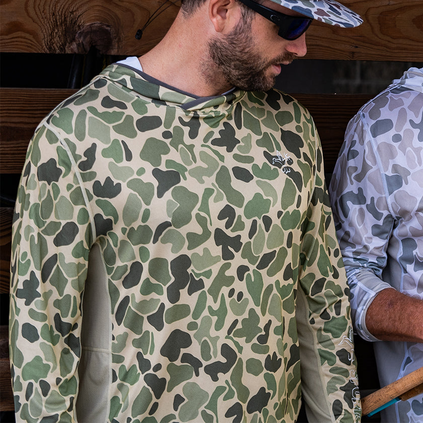 Blue camo performance fishing hoodie from Sportsman Gear, Cool Breeze 2.0 shirt designed for outdoor fishing activities.