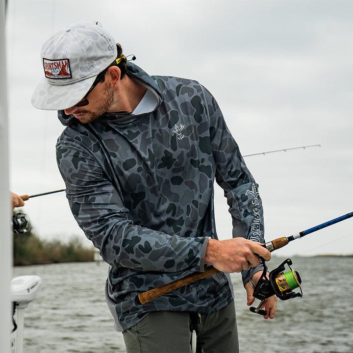 Sportsman Gear Cool Breeze 2.0 performance fishing hoodie in wave blue camo, shown as a lightweight, comfortable shirt.