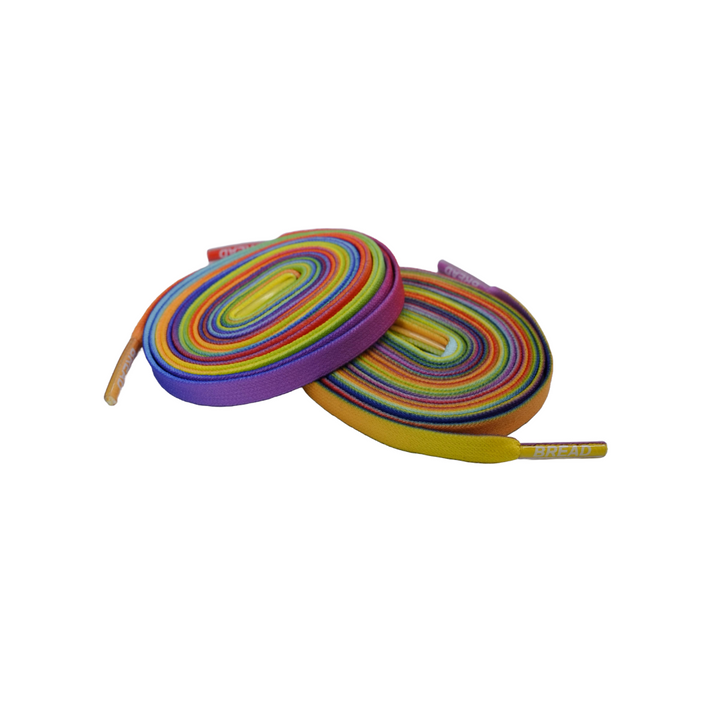 Colorful Prime Rainbow elastic shoelaces by Bread stacked in a pile, showcasing vibrant, flexible laces for sneakers or casual shoes.