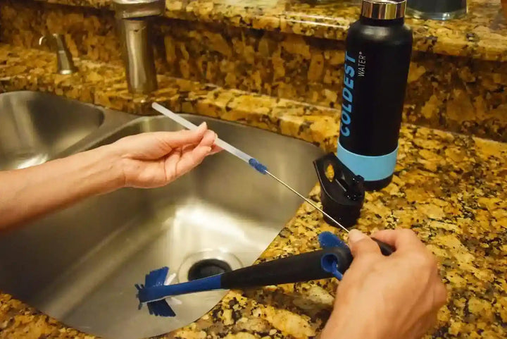 Coldest Water Bottle Brush with three cleaning tools, featuring a long handle, scrubbing brush, and flexible brush head for bottle cleaning