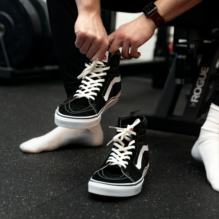 Elastic shoelace in Cloud White by Bread, showing a close-up of the white, stretchy laces on a shoe for a snug fit.