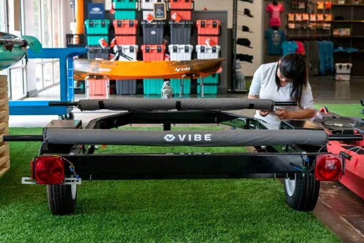 Pair of Vibe Kayaks roof rack crossbar pads for vehicle roof racks, providing protection and secure padding for gear.