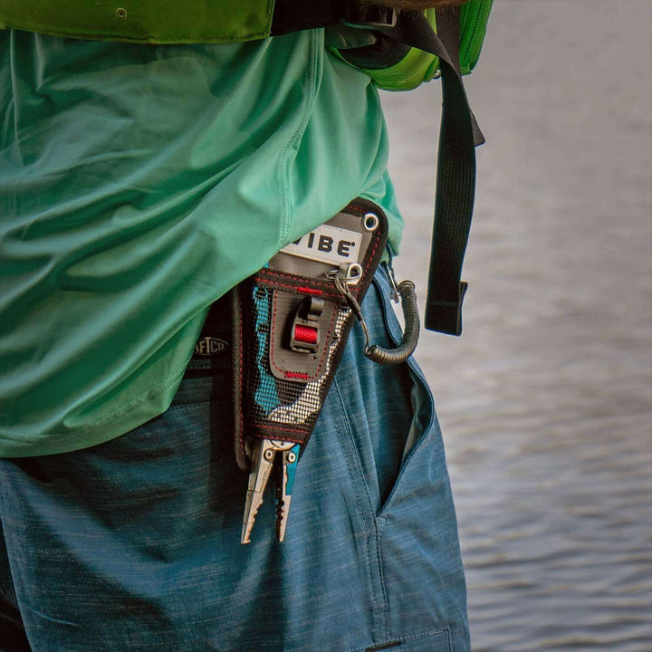 Vibe Kayaks mesh plier holder accessory with adjustable strap for secure attachment to kayak or gear storage.