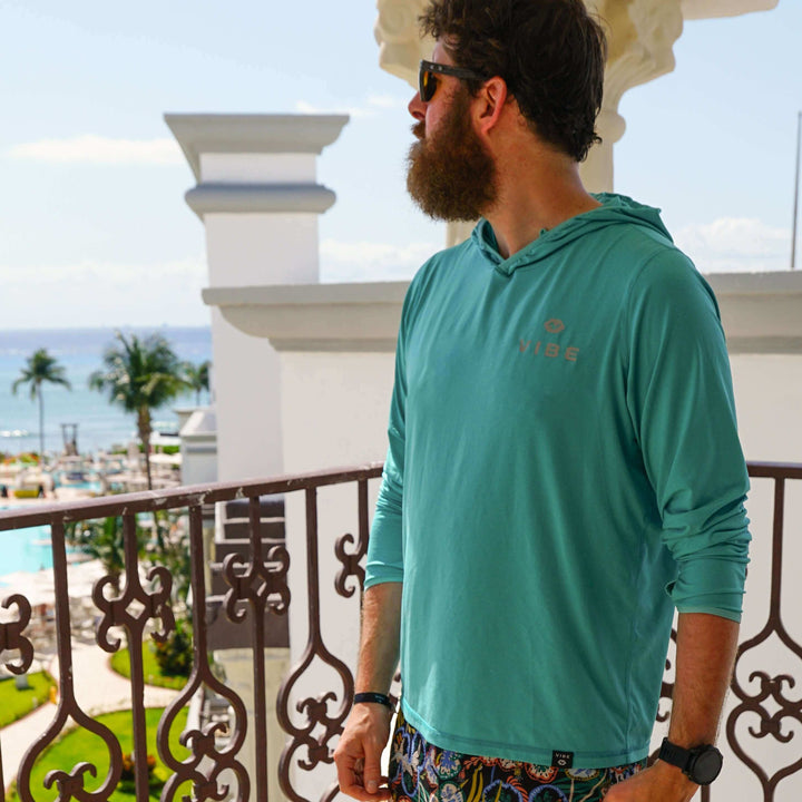 Vibe Performance Hoodie from Vibe Kayaks, showing a stylish black hoodie with the Vibe Kayaks logo on the front.