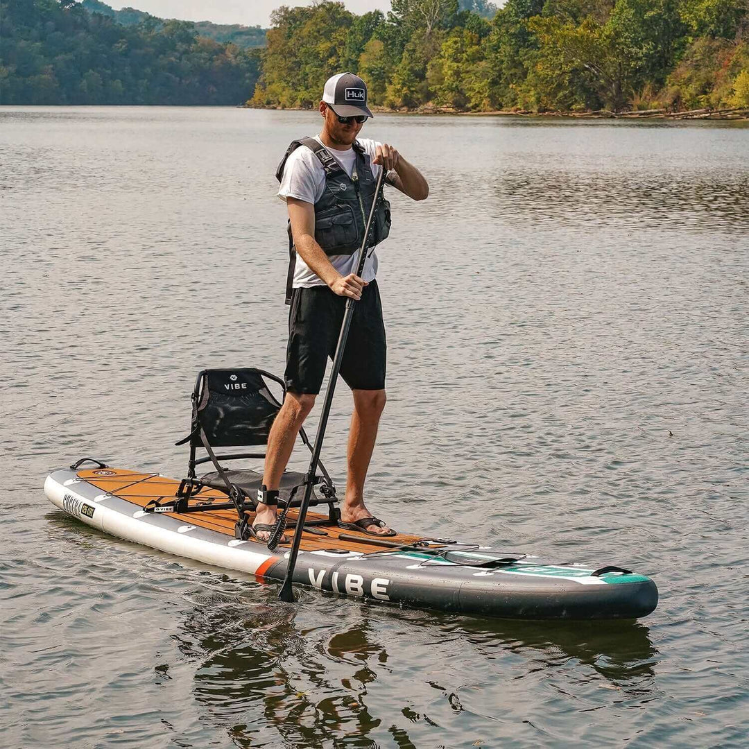 Vibe Kayaks Cubera 125 Lite inflatable kayak on water, showing its compact design and durable construction for paddling adventures.