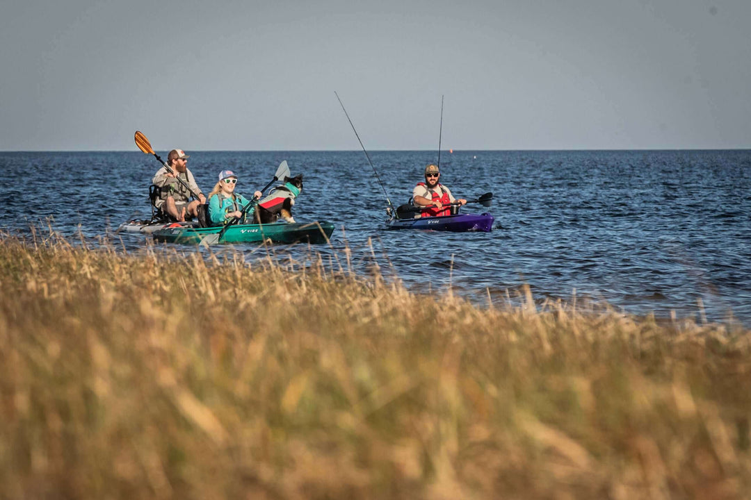 Vibe Shaka 100 kayak by Vibe Kayaks, featuring a sleek design and vibrant galaxy color for outdoor kayaking adventures.