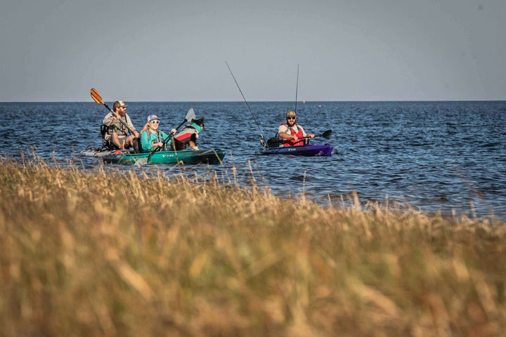 Vibe Shaka 100 kayak by Vibe Kayaks, featuring a sleek design and vibrant galaxy color for outdoor kayaking adventures.