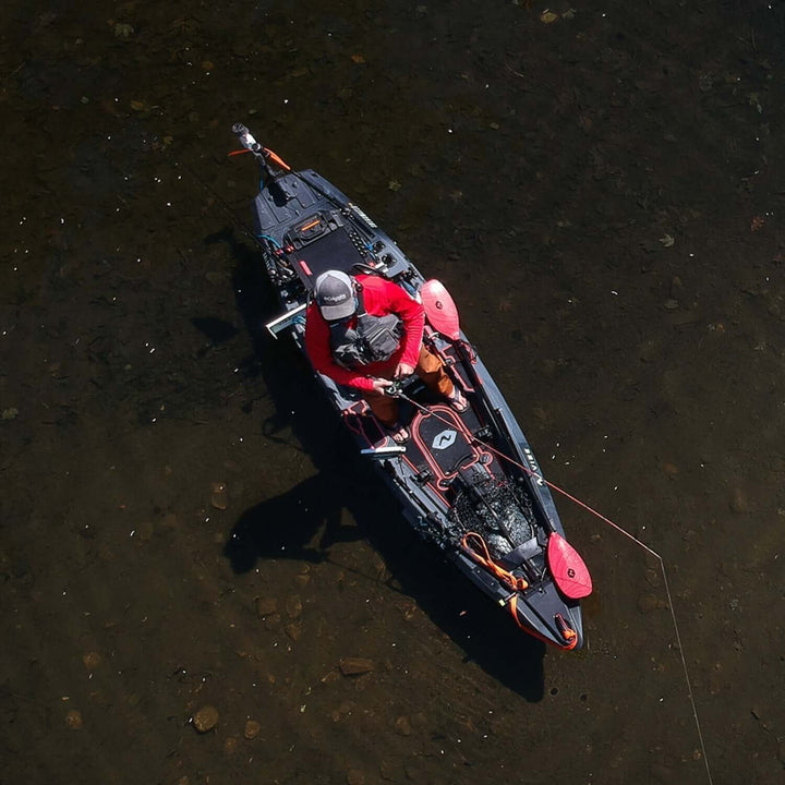 Vibe Shearwater 125 kayak by Vibe Kayaks, shown on water with sleek design and adjustable seat for sea kayaking adventures.