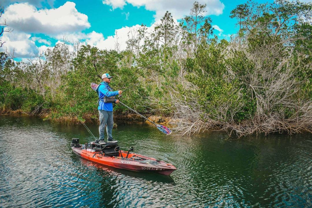 Vibe Shearwater 125 kayak by Vibe Kayaks, featuring a sleek design and seating area in a vibrant galaxy color.
