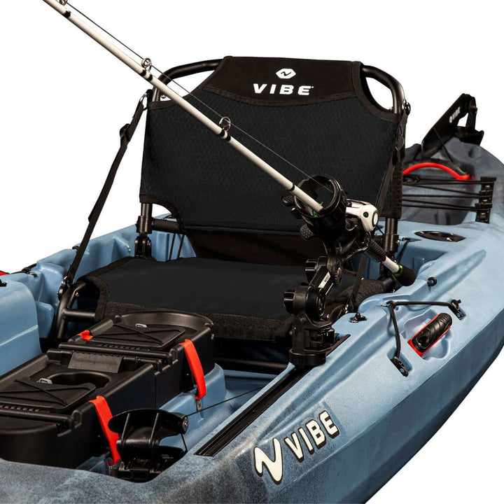 Vibe Sea Ghost 130 kayak in slate blue, featuring a sleek design with seating and storage area, by Vibe Kayaks.