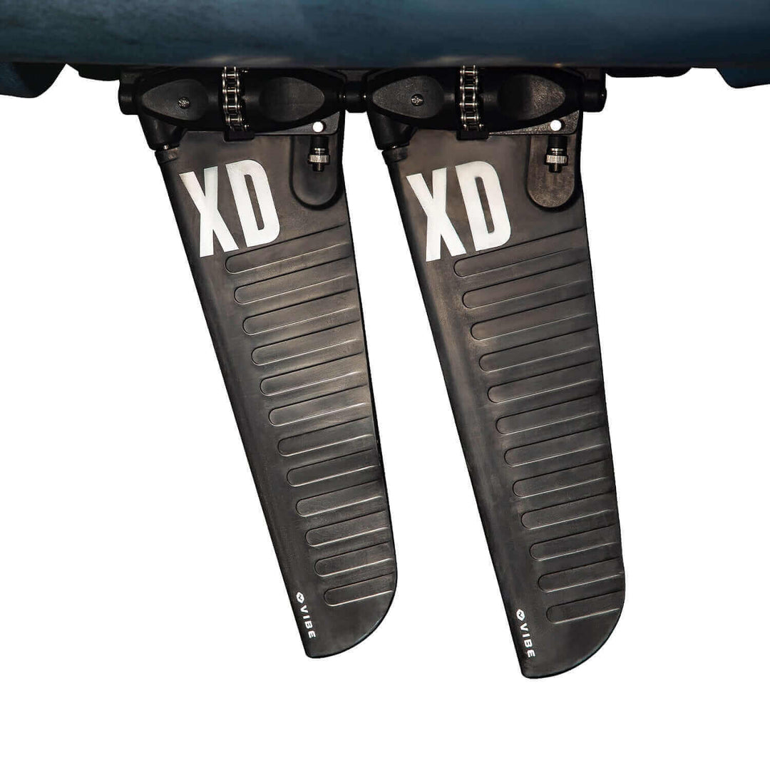 Vibe Kayaks Makana 100 kayak in vibrant color, featuring a sleek design with seating and footrests visible in the image.