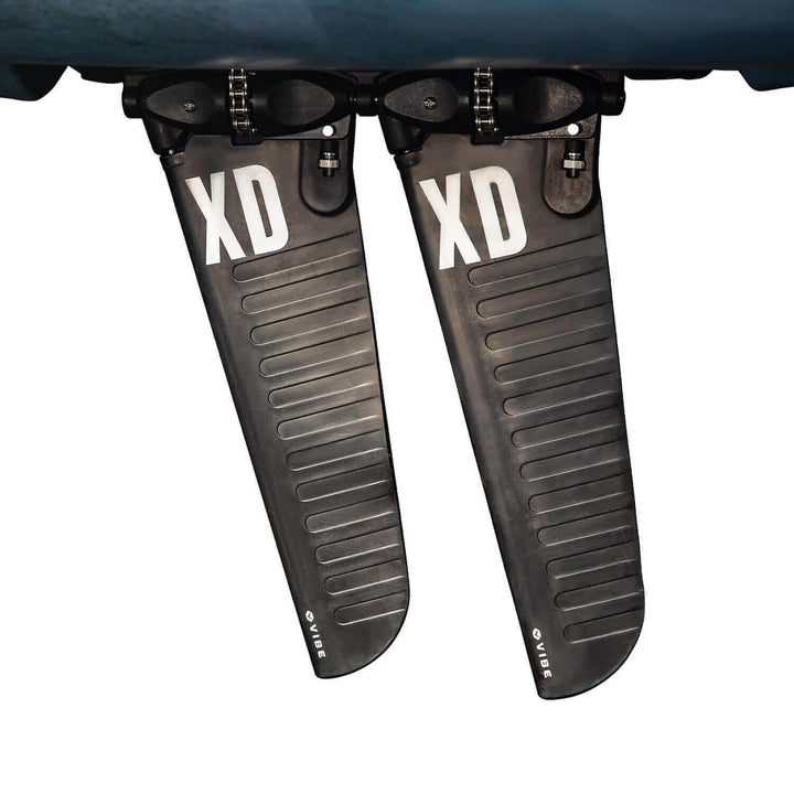 Vibe Kayaks Makana 100 kayak in blue, shown on water with seating and paddle areas visible.