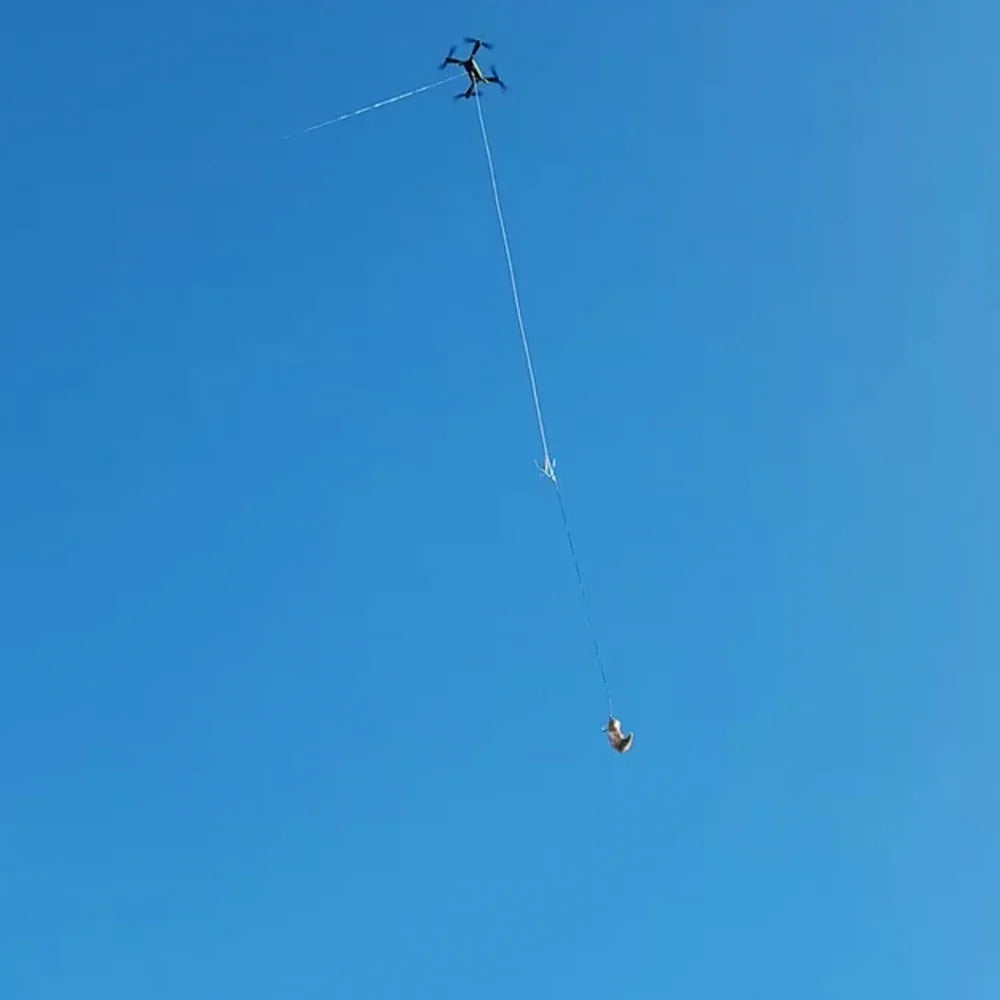 Xpece ONE Fishing Drone with payload drop capability flying in the sky during rescue operation.